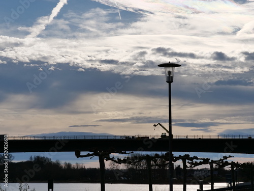 silhouette of a bridge across river