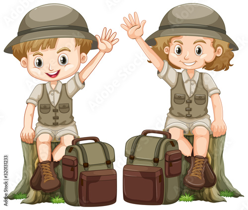Boy and girl in safari outfit sitting on log