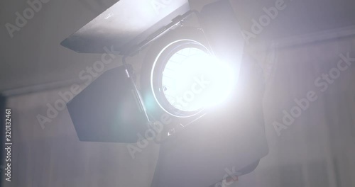 Cinema arri tungsten fresnel light turning, close up shot