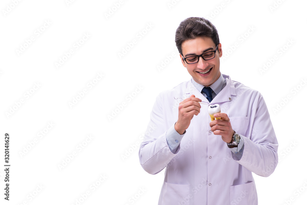 Young male doctor stomatologist isolated on white Young male doctor stomatologist isolated on white