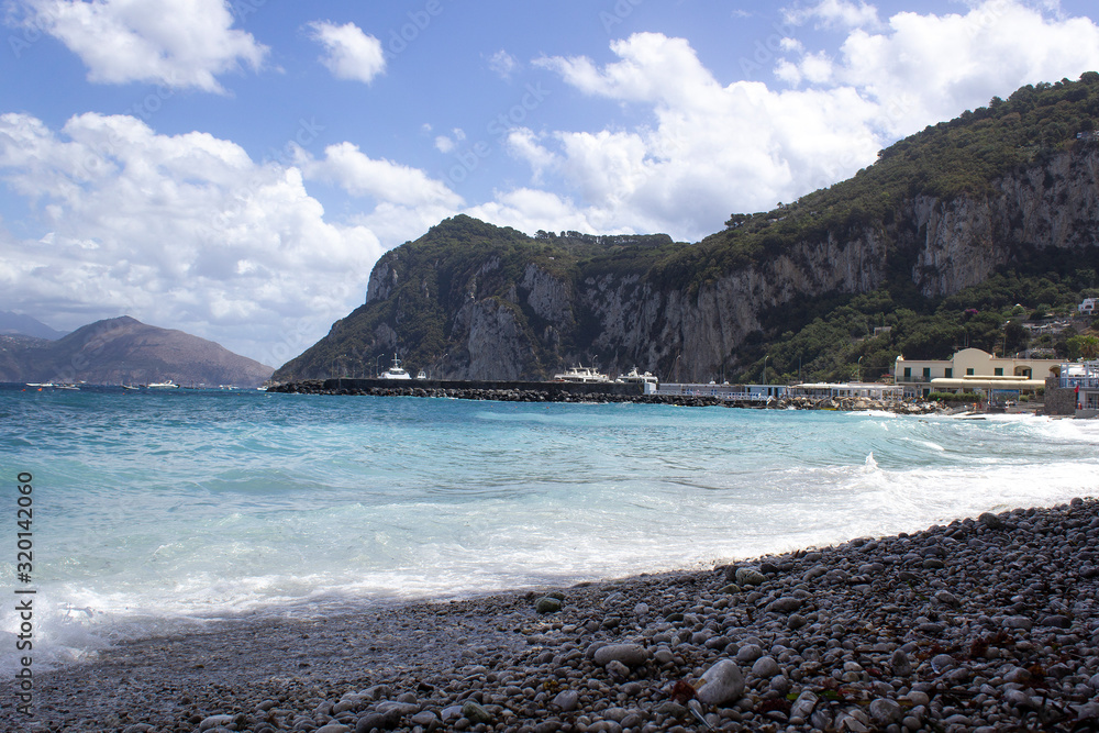 coast beach  blue water of mediterranean sea italy island beach port travel summer vacation tour