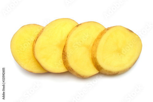 Creative young potato slice isolated on white background. Harvest new. Perfectly retouched, full depth of field on the photo. Flat lay, top view