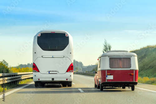 Camper and bus on the road in Switzerland.
