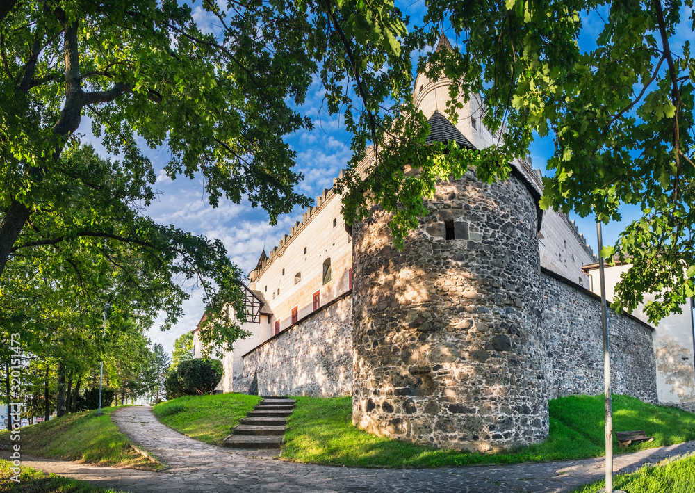 Medieval Towers of Zvolen Castle in Zvolen town, Slovakia. Panoramic summer view of Castle from park with beautiful path winding around the castle