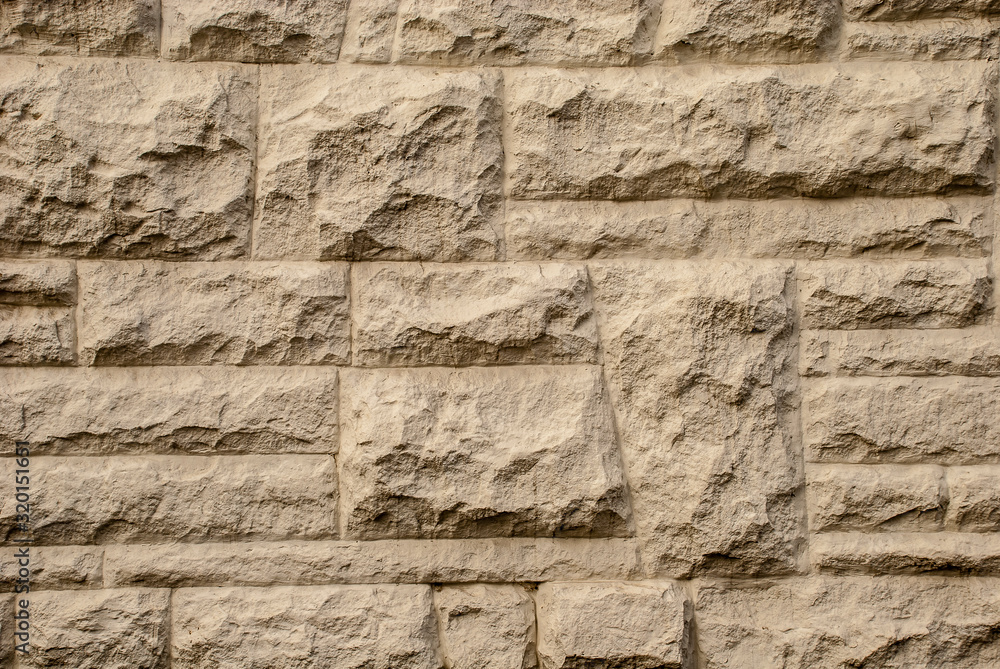 The texture of the wall is made of gray stone.