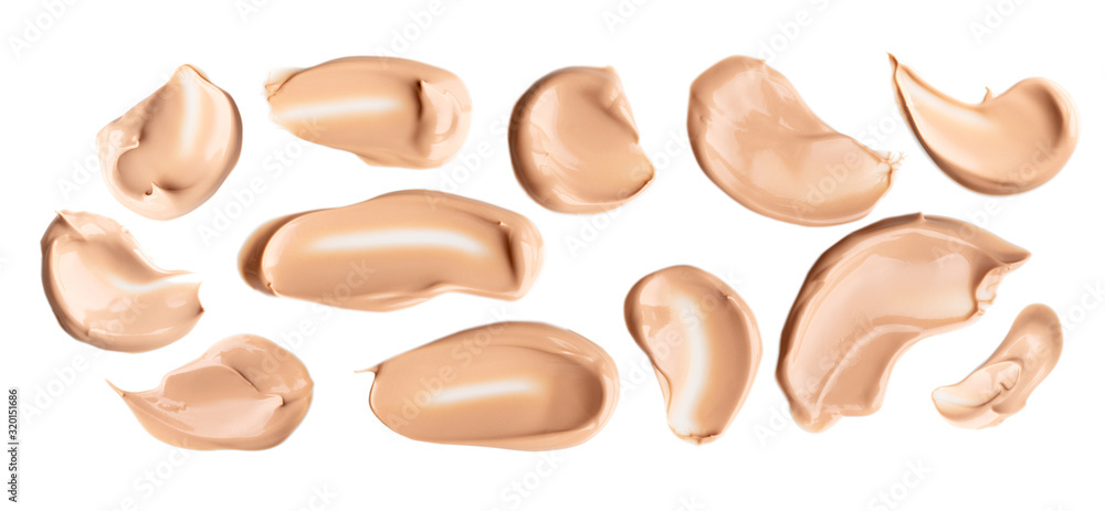 Set of liquid gently beige smears of makeup creamy foundation isolated on white background. Cosmetic concealer. Realistic brown cream texture for makeup. Set of liquid gently beige smears of makeup creamy foundation isolated on white background. Cosmetic concealer. Realistic brown cream texture for makeup.