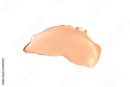 Liquid foundation smears isolated on white background. Cream texture for makeup.