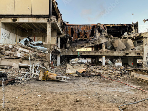 Ruins of a destroyed concrete building in a city