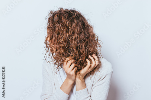 Canvastavla Unrecognizable young woman wearing white shirt applying with hands