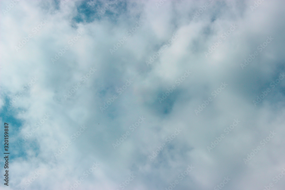 Fototapeta premium A lot of white clouds covering the blue sky.