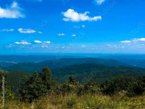 Mountain on blue background. Summer landscape. Travel background. Scenic mountain landscape. Summer scenery. Summer vacation.