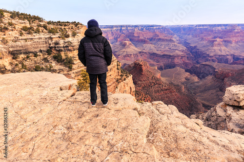 Young boy looks out over the Grand Canyon