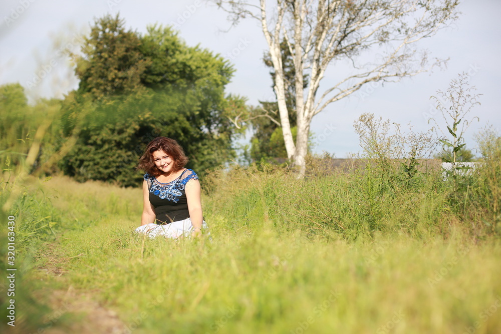young woman in park in a blouse of Irish lace young woman in park in a blouse of Irish lace