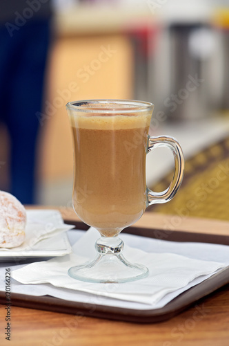 Closeup of glass of cappuccino on the table