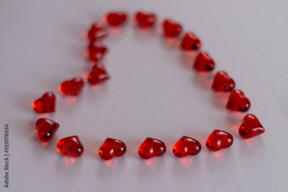 Red hearts lined in a heart shape on white background valentines Red hearts lined in a heart shape on white background valentines