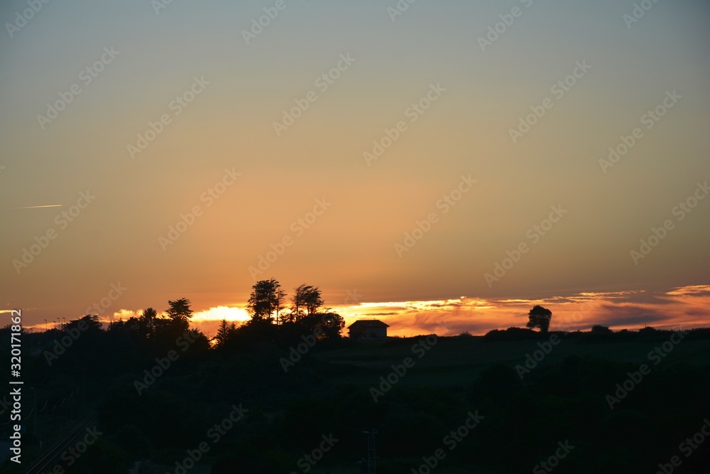 sunset over landscape and sky