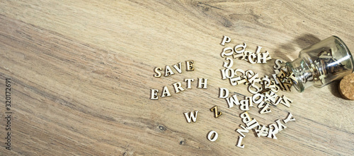 Wooden alphabet letter out of the bottle; save earth