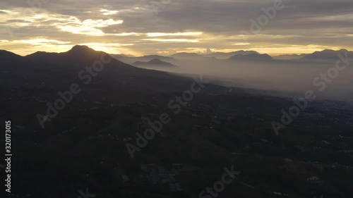 Wallpaper Mural Beautiful aerial footage of village and farmland on the mountain valley at dawn time in the misty morning at Dieng Plateau, Wonosobo, Central Java, Indonesia. Shot in 4k resolution Torontodigital.ca