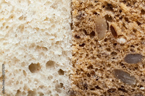 Slice of white bread and whole grain bread side by side