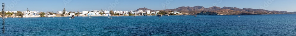 Clear water and buildings at beach in Pollonia village Clear water and buildings at beach in Pollonia village