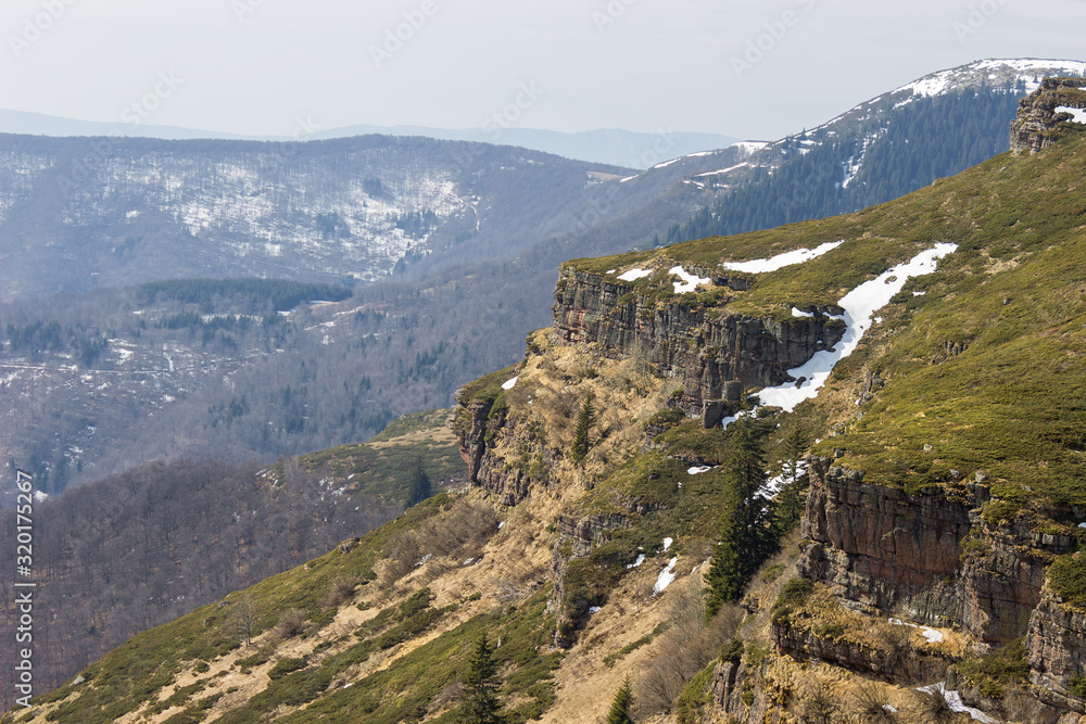 Alien, rocky landscapes of Old mountain in Serbia, near Kopren summit, vertical cliffs and famous juniper fields
