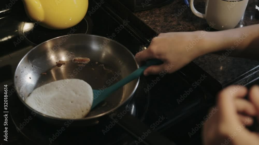 Canada - Cooking Delicious Pancake In A Pan Turning It Upside Down - Closeup Shot Canada - Cooking Delicious Pancake In A Pan Turning It Upside Down - Closeup Shot
