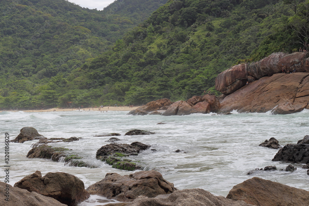 Trindade, Paraty/Rio de Janeiro/Brazil - 01-19-2020: Praia do Meio beach. Strong waves, dangerous sea, drowning risk, sorrounded by many rocks Trindade, Paraty/Rio de Janeiro/Brazil - 01-19-2020: Praia do Meio beach. Strong waves, dangerous sea, drowning risk, sorrounded by many rocks
