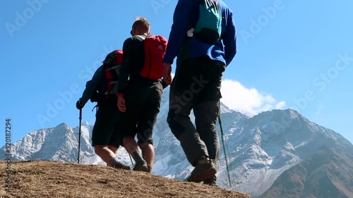 Group of mountaineers hiking in the mountains alone the trekking road to Everest Base Camp in Nepal