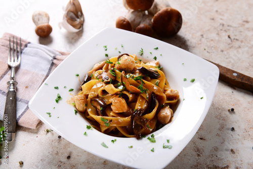 Tagiatelle pasta with creamy sauce with porcini mushrooms