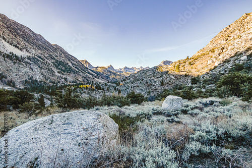 high altitude mountain pass with vista of canyon and peaks