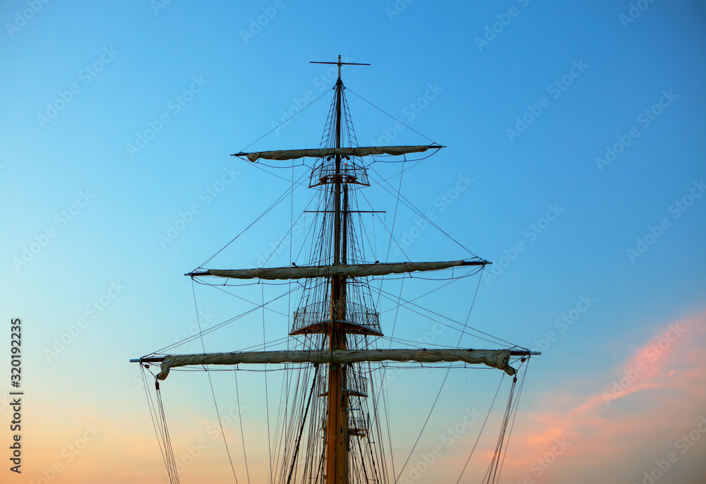 ship mast and ropes against evening sky