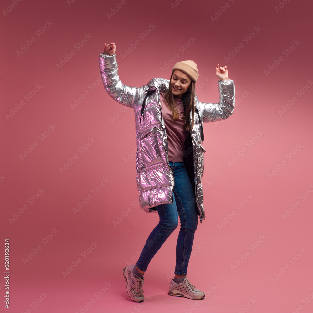 Trendy autumn and winter clothing, Studio shot on a pink background, copy space. Trendy autumn and winter clothing, Studio shot on a pink background, copy space.