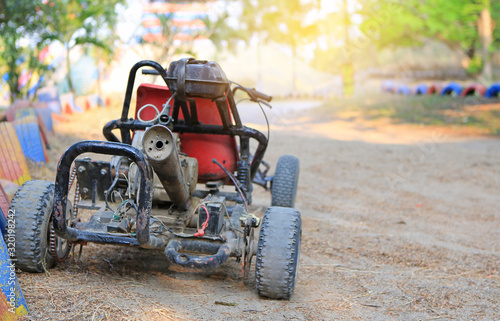 Old go-kart waiting for driver to drive in the track outdoor.