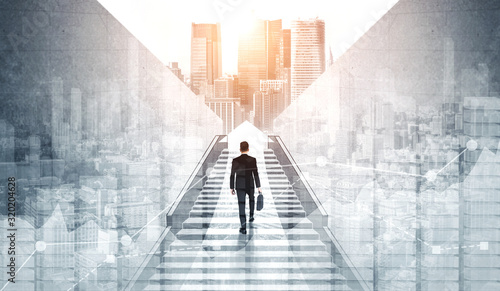 Fotografie Ambitious business man climbing stairs to meet incoming challenge and business opportunity