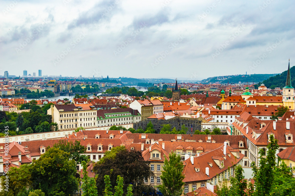Obraz premium Prague cityscape as seen from Prague Castle. The photo is taken at a cloudy afternoon.