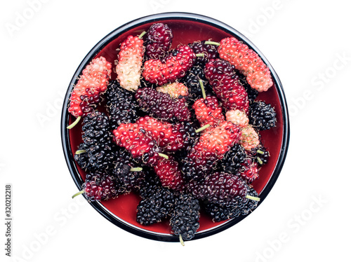 Fresh mulberries in small bowls isolate on a white background