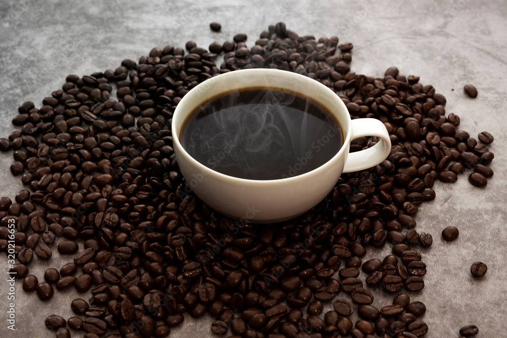 Hot Americano coffee with roasted coffee beans Hot Americano coffee with roasted coffee beans