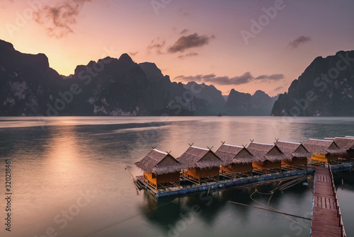 Beautiful sunset over the raft houses on Cheow Lan lake, Thailand.  photo