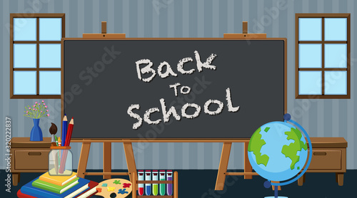 Back to school sign with many school items in classroom