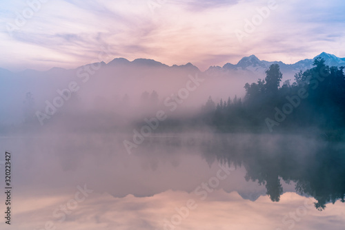 Morning fox over Matheson water lake, New Zealand natural landscape