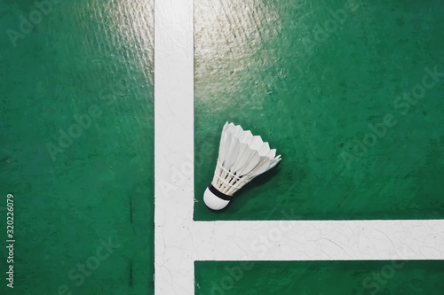 Top view, flat lay of shuttlecock on badminton court. A game with rackets and playing indoor Batminton. selective focus, copy space. Indoor Sport concept.