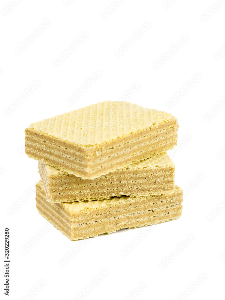 A stack of three sweet wafers isolated on a white background. A stack of three sweet wafers isolated on a white background.