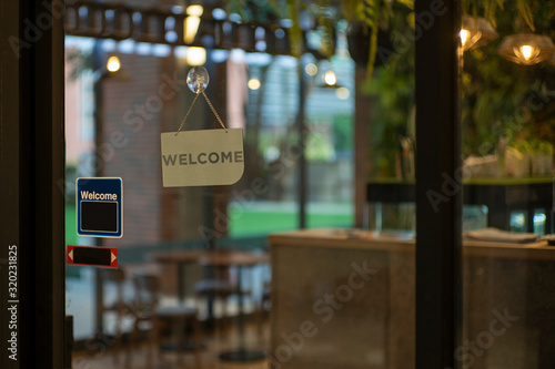 Welcome sign outside a restaurant, store, office or other photo