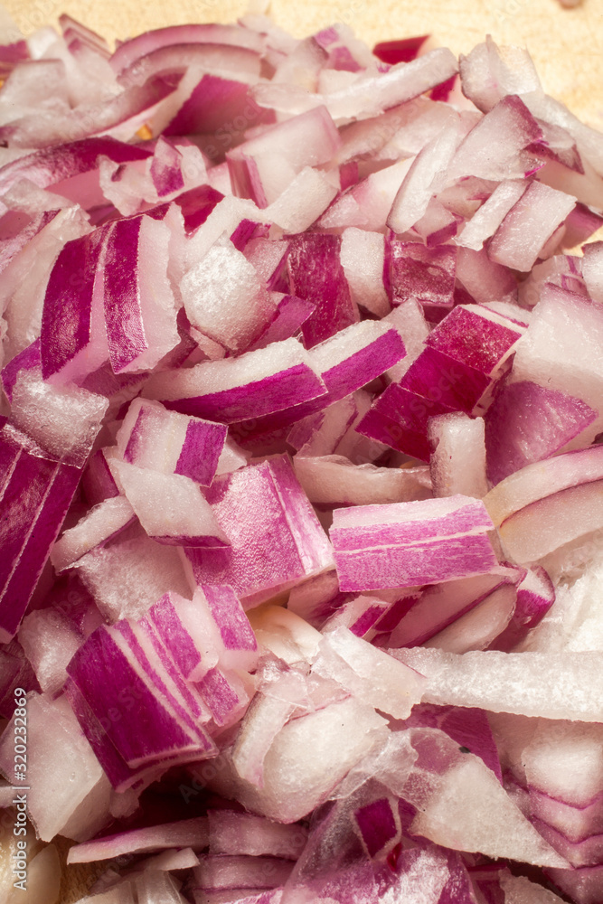 cut red onion on wooden plate cut red onion on wooden plate