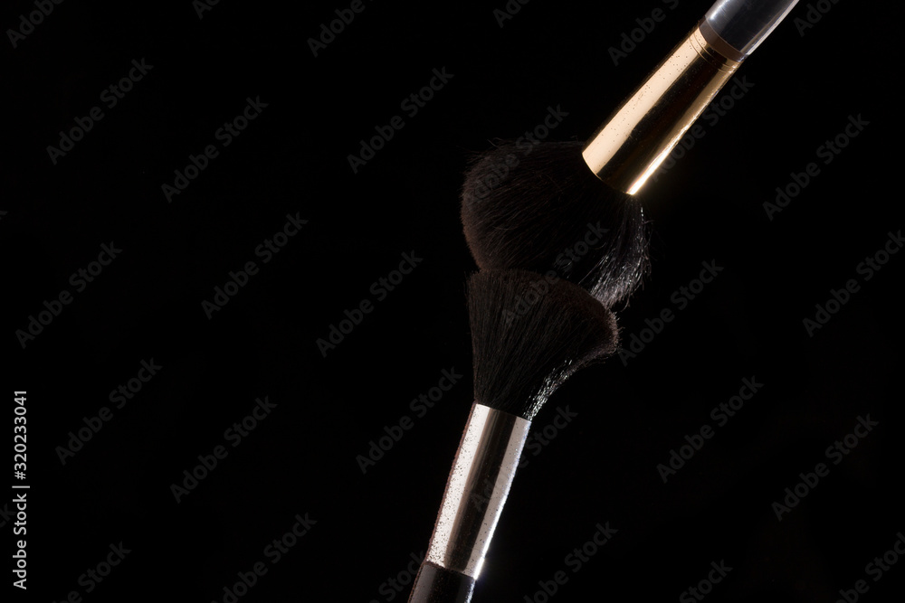 Make-up brush on black background. close up Make-up brush on black background. close up
