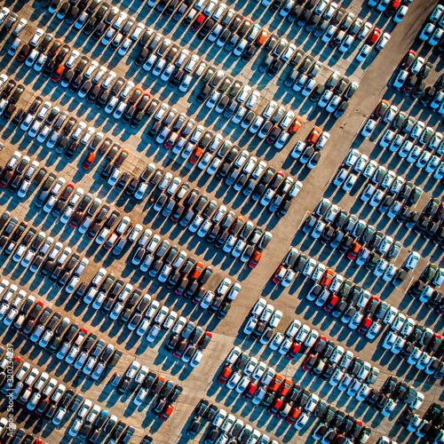 Top view of new cars lined up outside an automobile factory