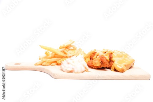 Valokuva A cheesy chicken breast set with fries and coleslaw insight