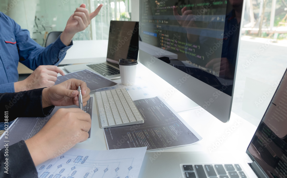 Programmers work on the development of coding and coding technology on white desks and website design, software, data processing companies, servers. Programmers work on the development of coding and coding technology on white desks and website design, software, data processing companies, servers.