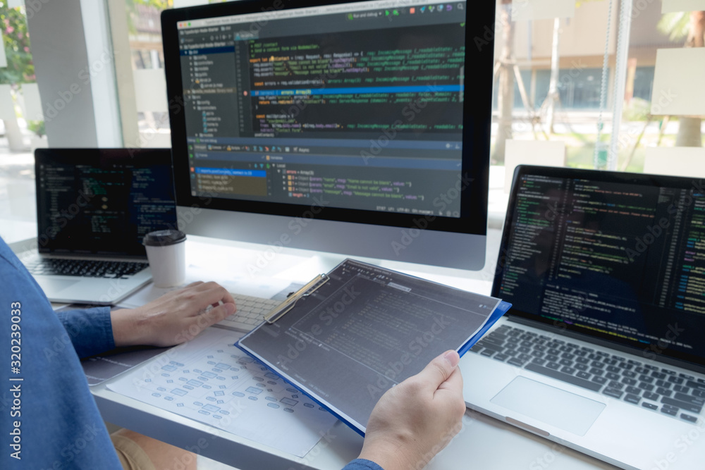 Programmers work on the development of coding and coding technology on white desks and website design, software, data processing companies, servers. Programmers work on the development of coding and coding technology on white desks and website design, software, data processing companies, servers.