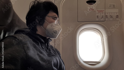 Photography Chinese traveler wearing mask while boarding on airplane flight prevent from 201